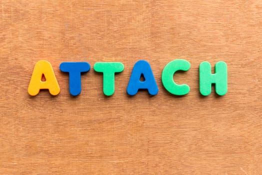 attach colorful word on the wooden background