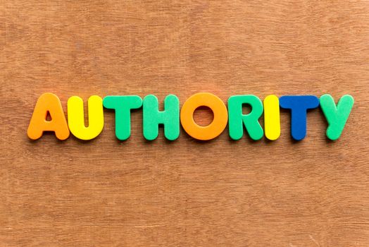 authority colorful word on the wooden background