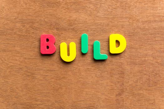 build colorful word on the wooden background