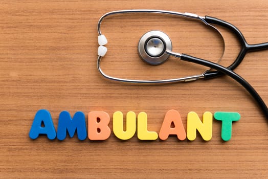 ambulant colorful word on the wooden background
