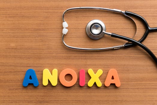 anoixa colorful word on the wooden background