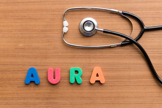 aura colorful word on the wooden background