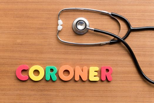 CORONER colorful word on the wooden background