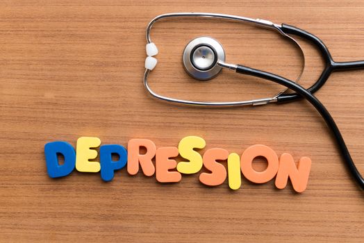 DEPRESSION colorful word on the wooden background