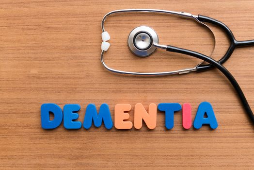 DEMENTIA colorful word on the wooden background