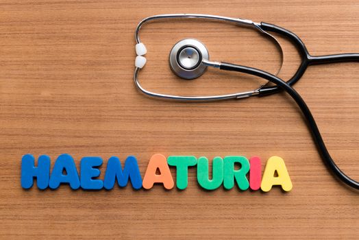 haematuria colorful word on the wooden background