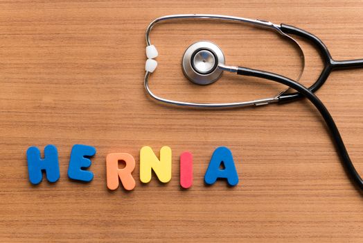 hernia colorful word on the wooden background