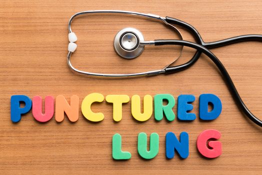 punctured lung colorful word on the wooden background