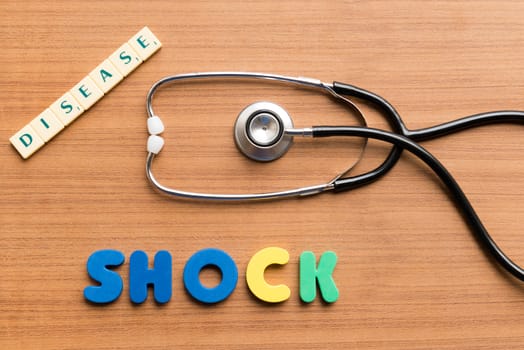 colorful shock word on the wooden background