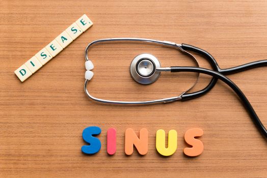 colorful sinus word on the wooden background