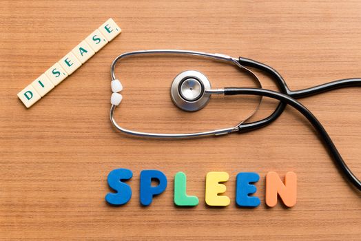 colorful spleen word on the wooden background