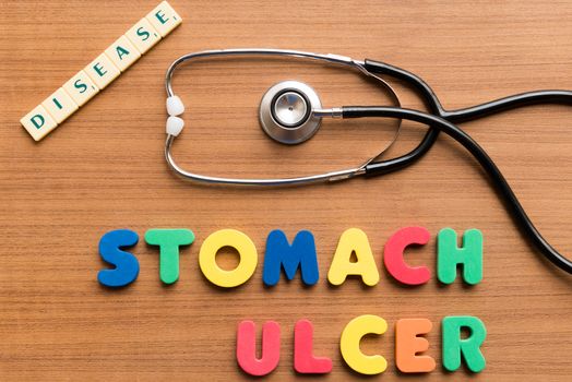 stomach ulcer colorful word on the wooden background