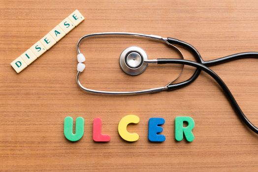 ulcer word on the wooden background