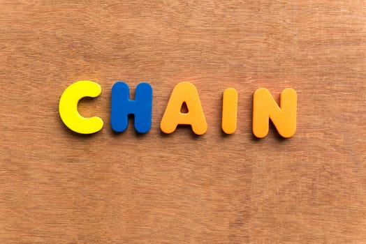 chain colorful word on the wooden background