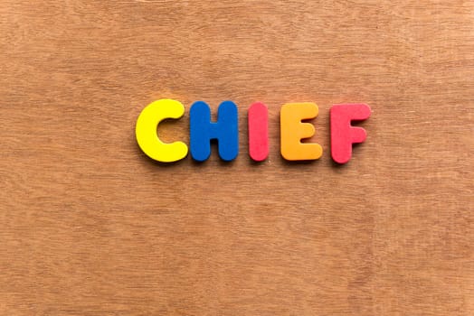 chief colorful word on the wooden background