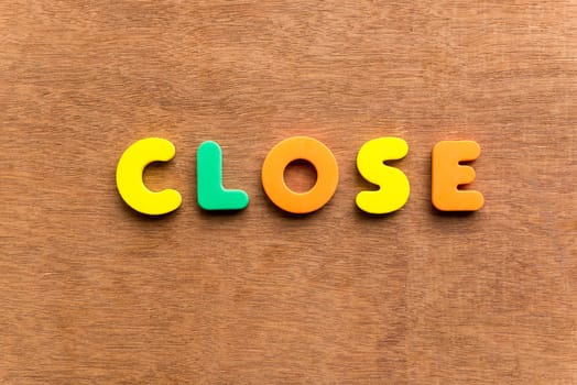 close colorful word on the wooden background