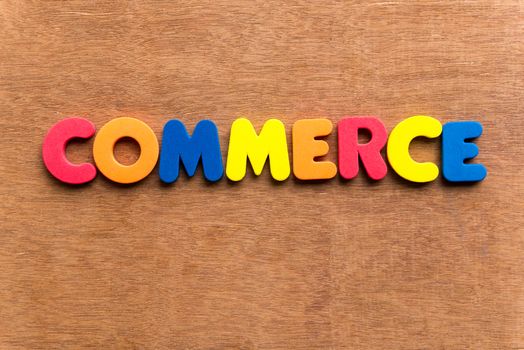 commerce colorful word on the wooden background