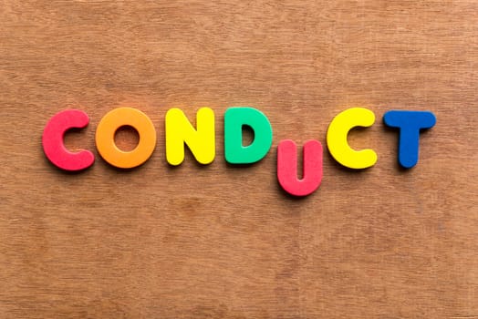 conduct colorful word on the wooden background