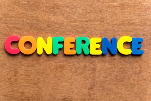 conference colorful word on the wooden background