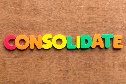 consolidate colorful word on the wooden background
