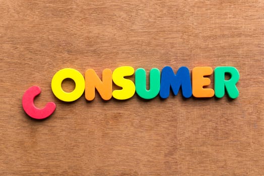 consumer colorful word on the wooden background