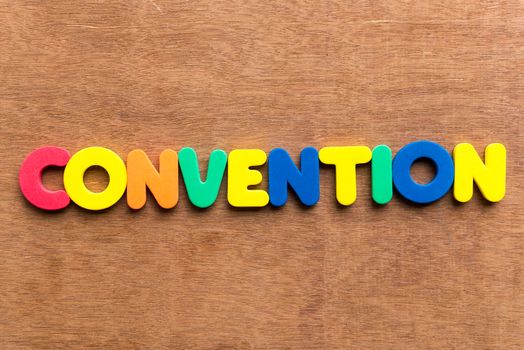 convention colorful word on the wooden background