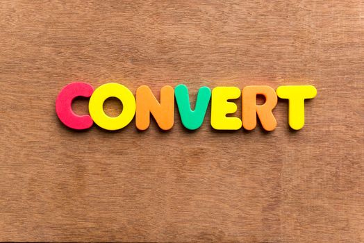 convert colorful word on the wooden background