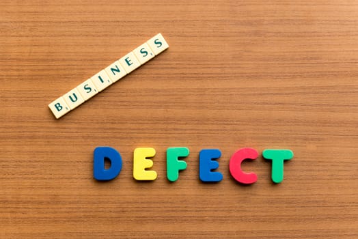 defect colorful word on the wooden background