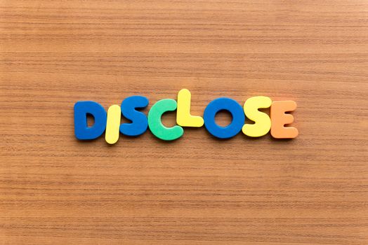 disclose colorful word on the wooden background