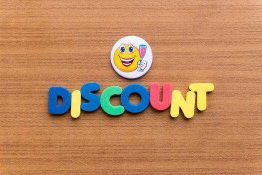 discount colorful word on the wooden background