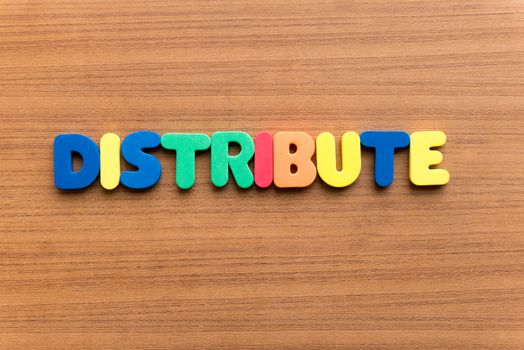 distribute colorful word on the wooden background