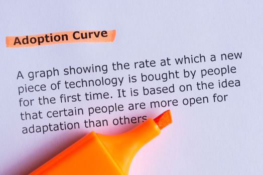 adoption curve word highlighted on the white paper