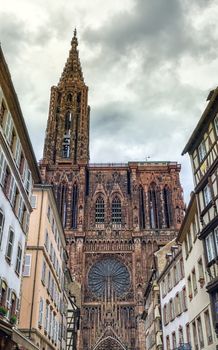 Cathedrale Notre-Dame or Cathedral of Our Lady of Strasbourg behing famous typical half-timbered houses, Alsace, France
