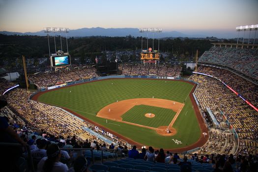 A Dodgers baseball game at dusk at Dodger Stadium in Los Angeles.