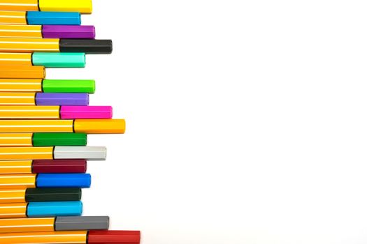 Colorful pens on isolated white background
