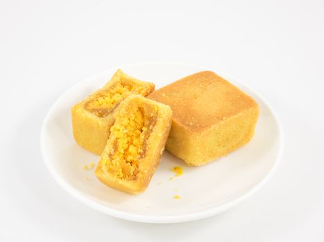 The tasty Taiwanese pineapple pastry cake on the small white square dish.