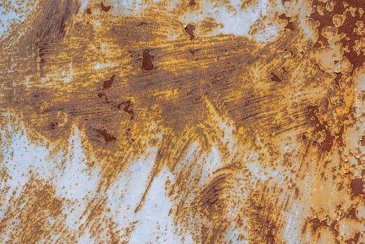 rusty iron surface covered with old chipped grey color paint, which has long been influenced by different climatic conditions