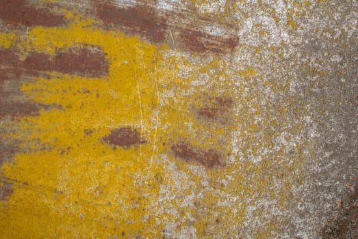 fragment of a rusty iron surface covered with old paint, which has long been under the influence of different climatic conditions