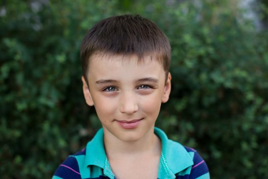 Portrait of a boy close up in nature