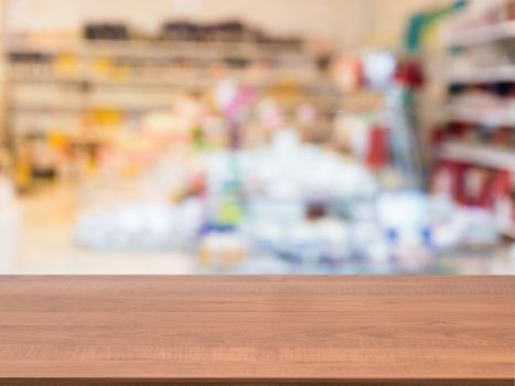 Marble board empty table in front of blurred background. Perspective marble table over blur in interior of abstract shop. Mock up for display or montage your product.