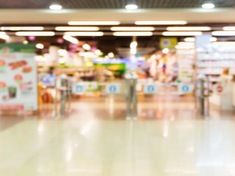 Abstract blurred entrance area of supermarket as background
