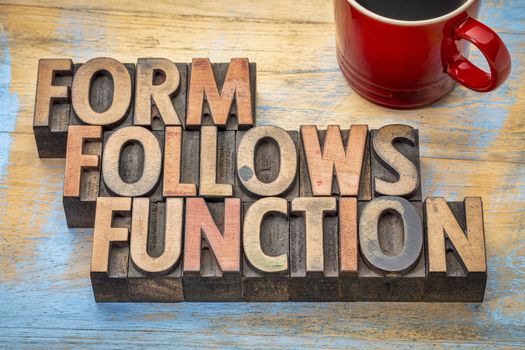 Form follows function - design concept - text in vintage letterpress wood type printing blocks with a cup of coffee