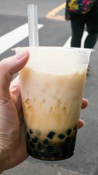 The tasty Taiwanese bubble tea drink (pearl milk tea) at food street market in Taipei, Taiwan.
