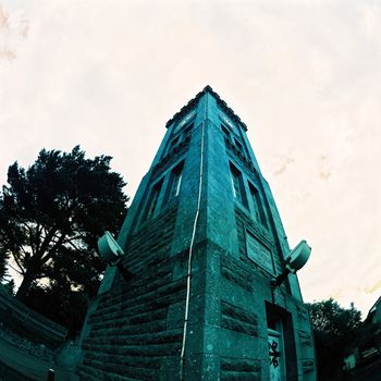 Color film image of clock tower in Kingussie