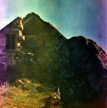 Color film image of a house ruin 