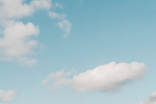 Vintage look sky background with instant camera film grain applied