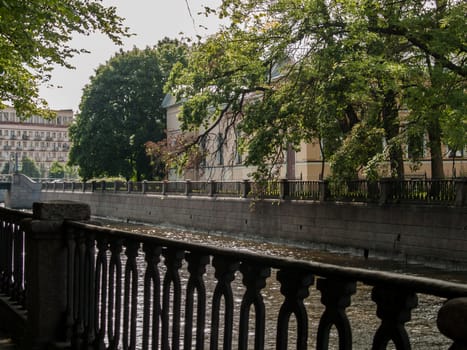 Granite channel embankment in the big city clear summer day