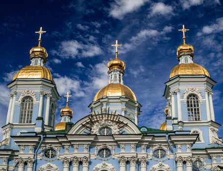 Golden dome of St. Nicholas Cathedral in Saint Petersburg on a clear sunny day