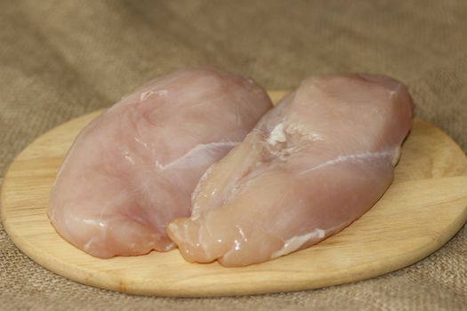 picture taken January 16, 2016 Jablonec nad Nisou, Czech Republic chicken breast on a cutting board bright background