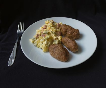 potato salad, meatballs, white plate, dark background, fork
Photo taken June 16, 2015 home atelier Czech Republic